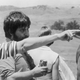 Spielberg points while Hooper has a Coke. (Photo: Getty Images)